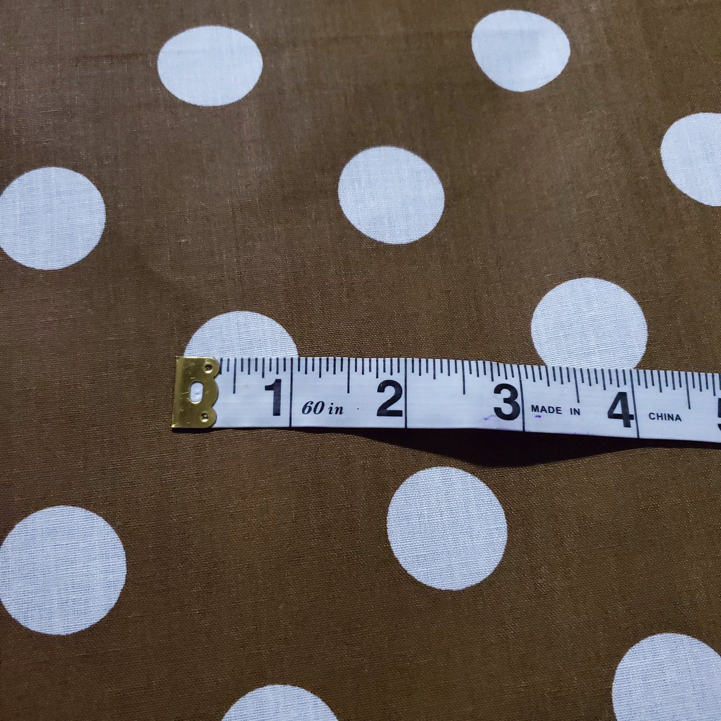 ONE INCH POLKA DOT WHITE ON BRONZE GOLD