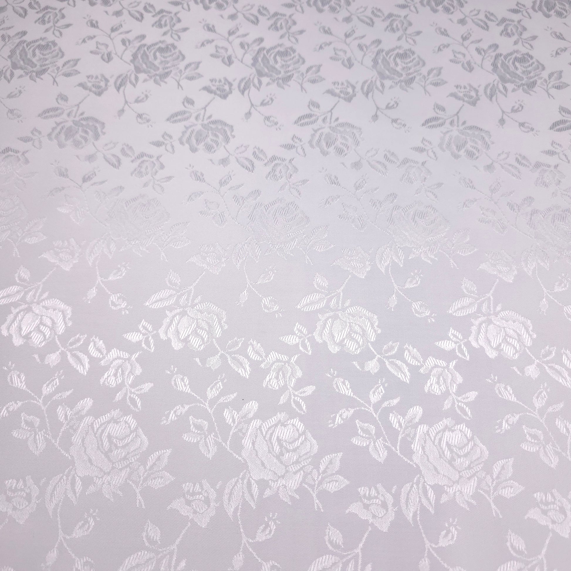 White floral pattern on a true white background
