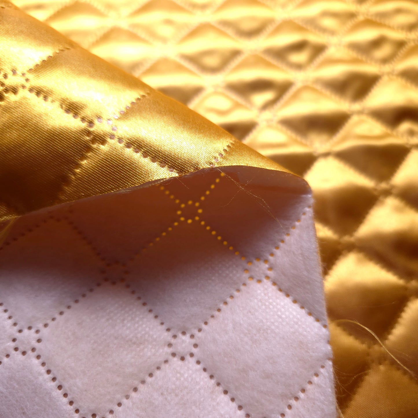 GOLD TAFFETA HEAT FUSED DIAMOND QUILTED BATTING FABRIC