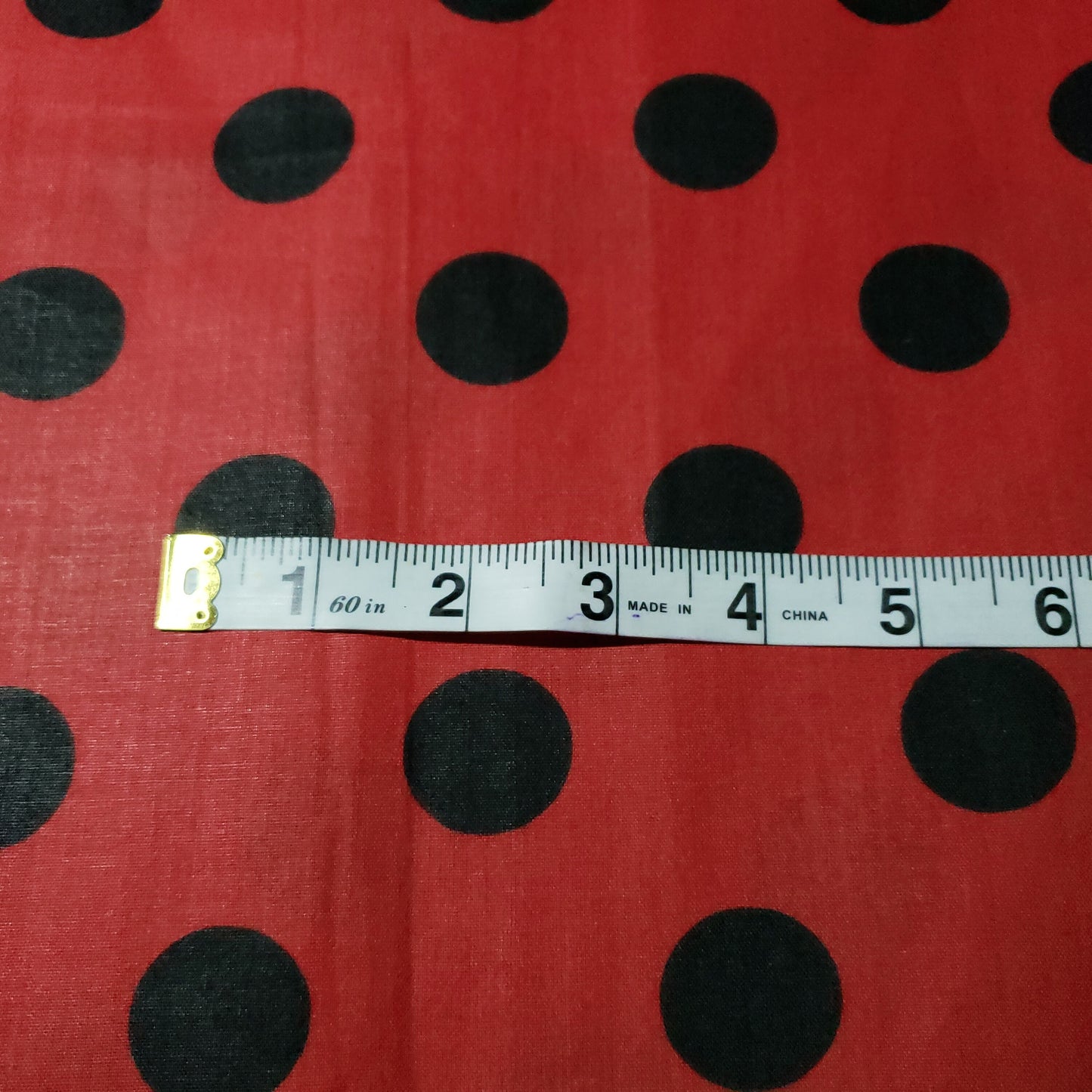 ONE INCH POLKA DOT BLACK ON RED