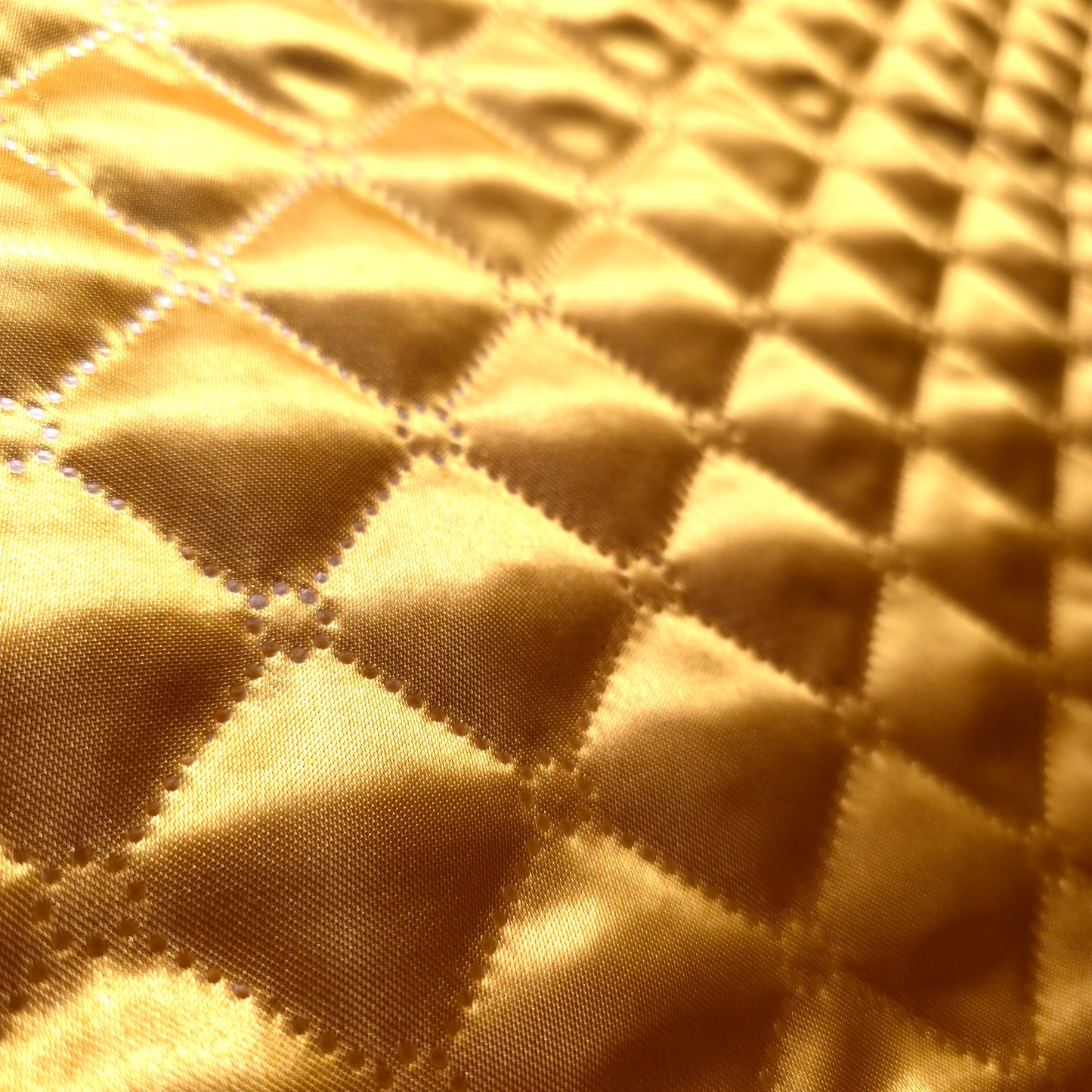 GOLD TAFFETA HEAT FUSED DIAMOND QUILTED BATTING FABRIC