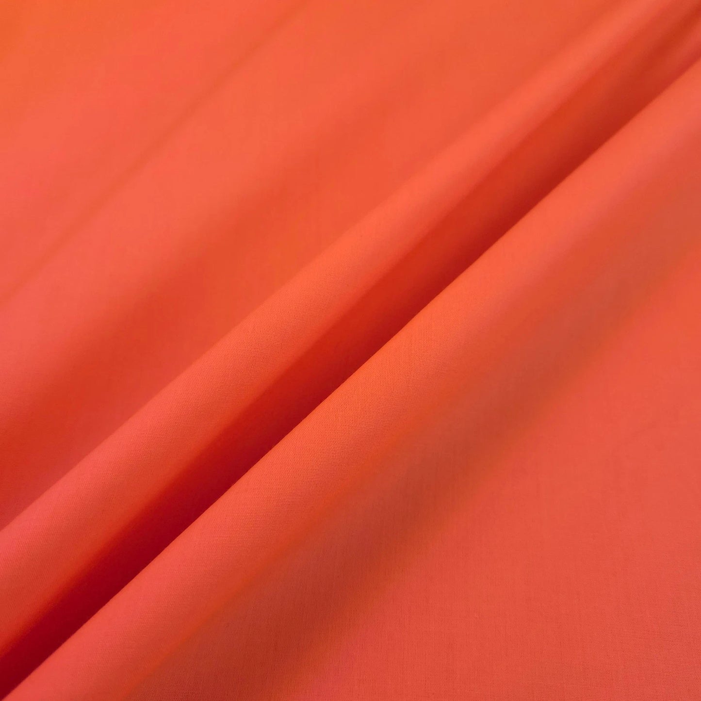 UV REACTIVE NEON ORANGE POLY COTTON SOLID COLOR