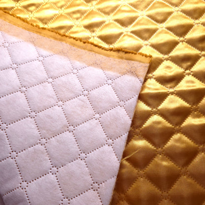 GOLD TAFFETA HEAT FUSED DIAMOND QUILTED BATTING FABRIC